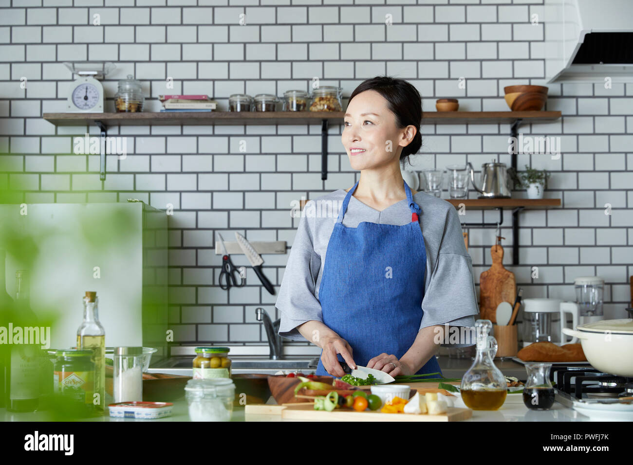 Japanese mature woman in the kitchen Stock Photo Alamy