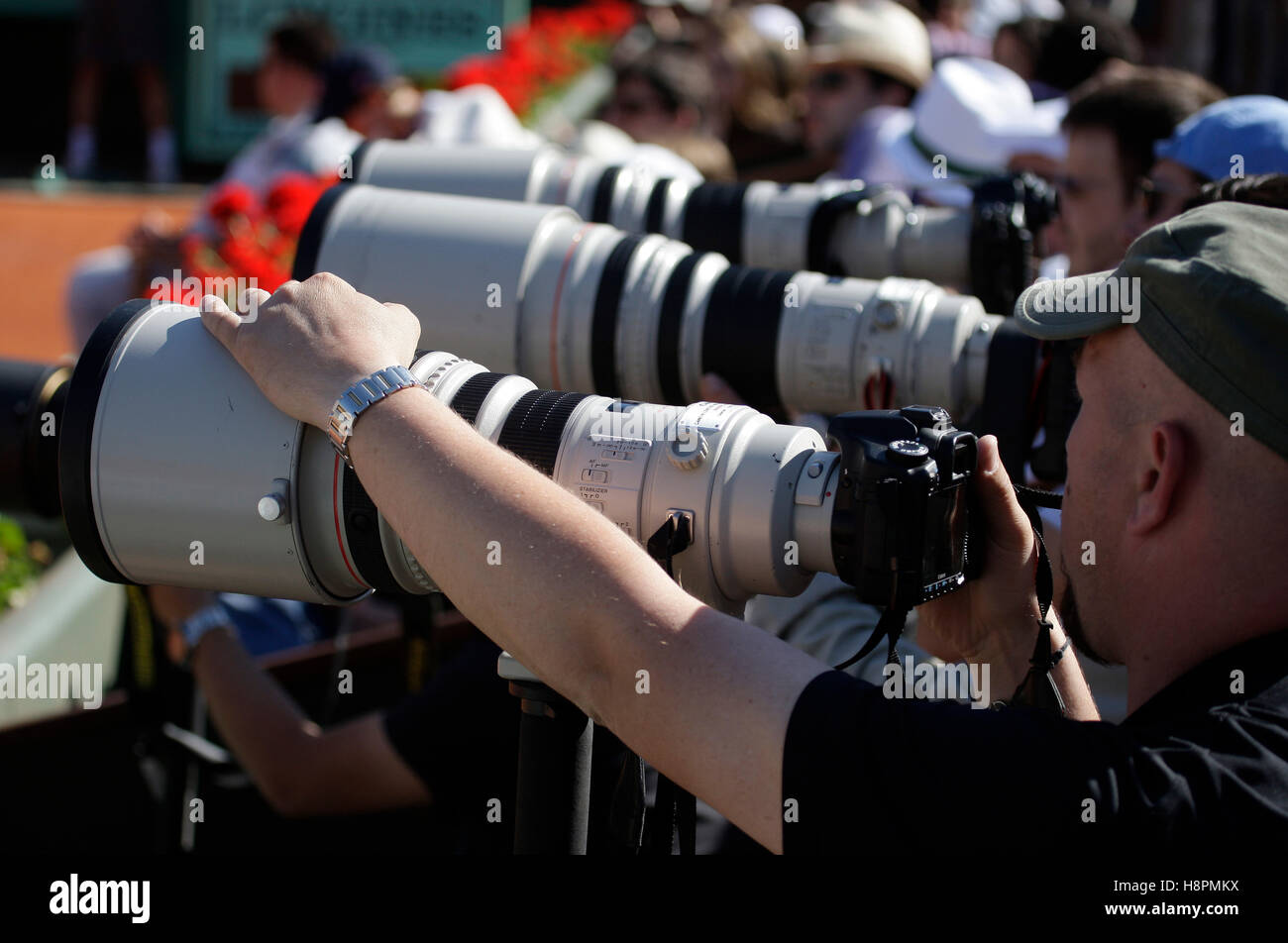 Sports photographers with telephoto lenses tennis the ITF Grand Stock 