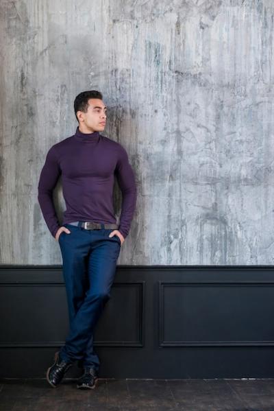 Attractive Young Man Leaning on Concrete Grey Wall