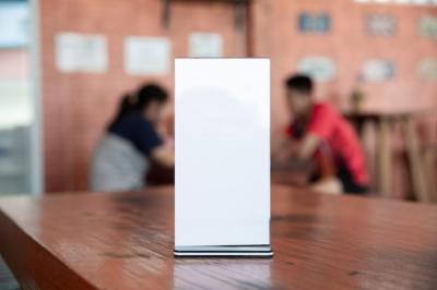 Menu Frame Mockup on Table in Bar Restaurant-Cafeteria