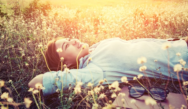 Girl lying in a field – Free Download Stock Photo