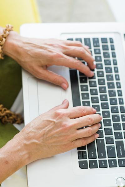 Senior Woman’s Hand Typing on Laptop Keyboard: Free Stock Photo Download