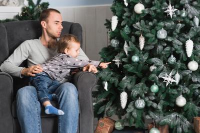 Christmas Celebrations with Man and Kid Next to Christmas Tree