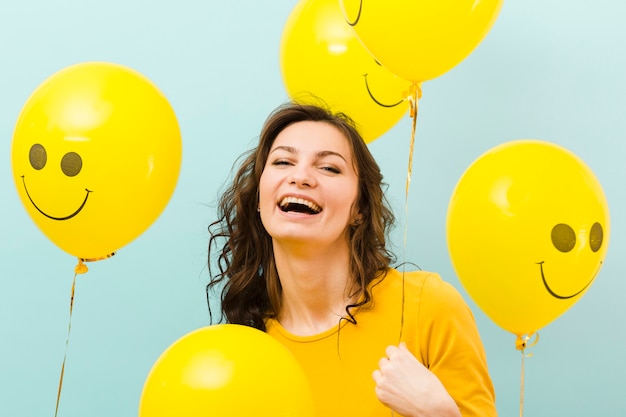 Front view of woman with balloons – Free Stock Photo