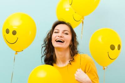 Front view of woman with balloons – Free Stock Photo