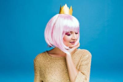 Charming Young Woman with Cut Pink Hair and Golden Sweater