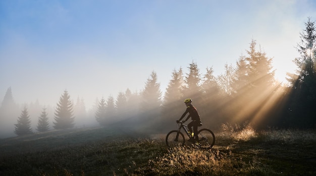 Male Cyclist Riding Bicycle in the Morning – Free Download