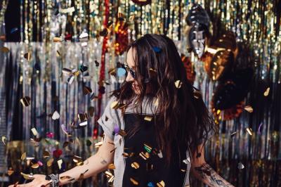 Portrait woman enjoying party and confetti