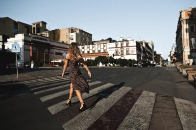 Back View of Girl in Dress and High Heels on Empty City Street