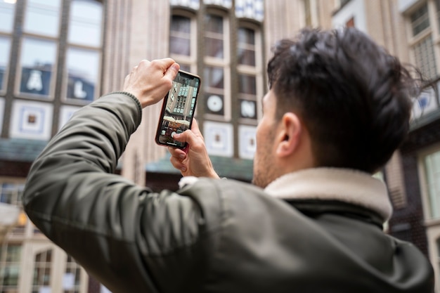 Close up man taking photos outdoors – Free Stock Photo