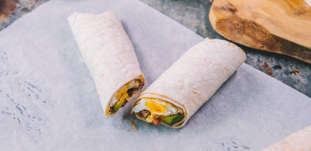 Close-up of wrap tacos on butter paper