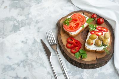 Top view tasty toasts with tomatoes and olives on wooden board white background bread burger snack dinner horizontal sandwich food lunch