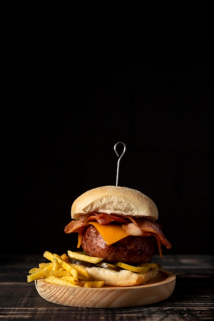 Front view cheeseburger and fries with copy-space