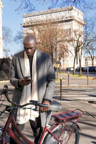 Man using smartphone in city of France