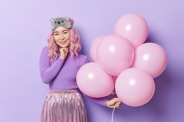 Pink Haired Asian Woman Celebrating Birthday with Balloons