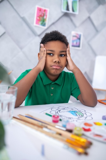 Free Stock Photo: Pensive Boy Meditating at Table