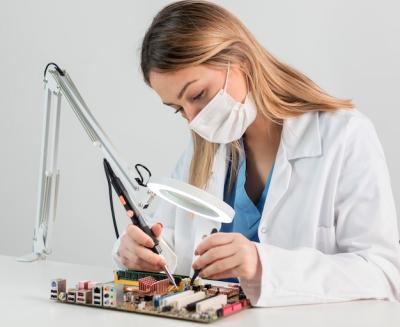 Medium shot woman with face mask working