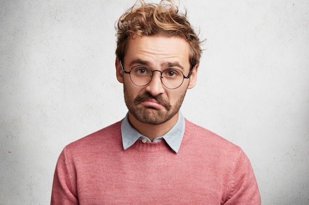 Young Man with Beard and Round Glasses