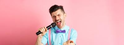 Passionate Singer Holding Microphone at Party and Festive Event