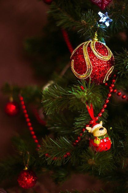 Cute and Festive: Red Toys Hanging on a Christmas Tree | Free Stock Photo Download