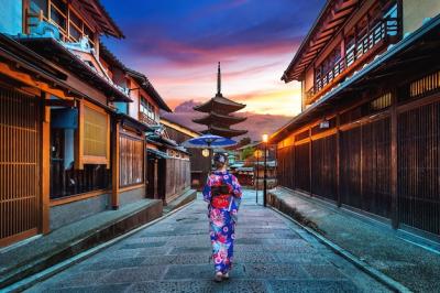 Asian woman wearing japanese traditional kimono at Yasaka Pagoda and Sannen Zaka Street in Kyoto, Japan