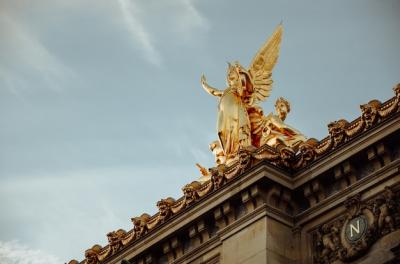 Golden Statue of a Woman with Wings in Paris, France