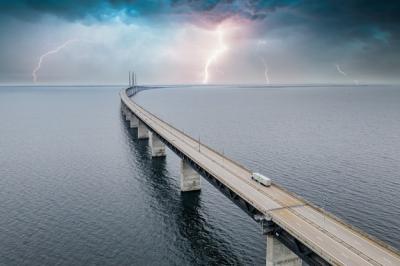 Mesmerizing Aerial View of the Bridge between Denmark and Sweden with Lightning