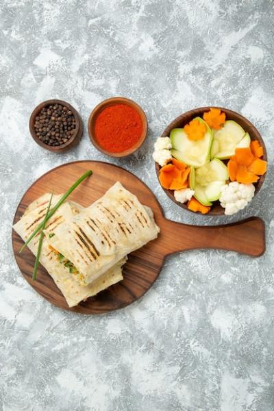 Top view sliced sandwich with vegetables and seasonings on the white background bread meal sandwich burger food