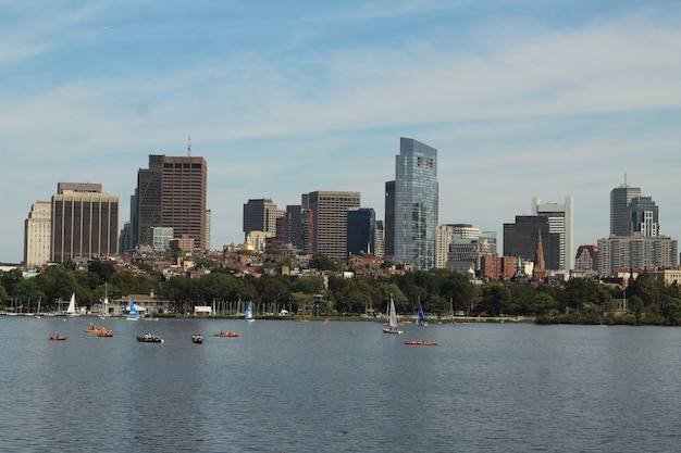 Skyline Picture of Boats Sailing in the Water near a Big City on a Sunny Day