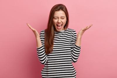 Young brunette woman in striped shirt