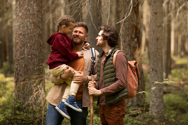 Girl with her dads enjoying family trip