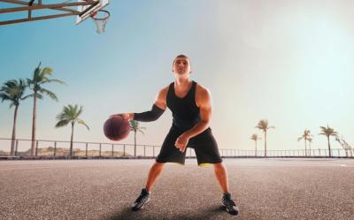 Basketball Player in Action at Sunset – Free Stock Photo Download