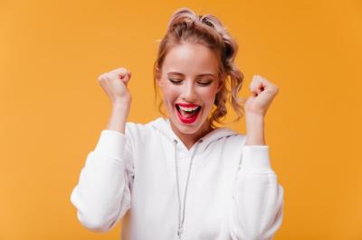 Attractive woman rejoices victory in competitions