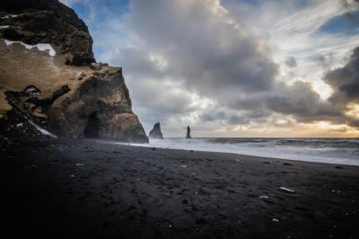 Beautiful Coast of the Sea at Vik, Iceland with Breathtaking Clouds and Rocks on the Side