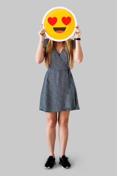 Cheerful Woman Holding Emoticon Icon