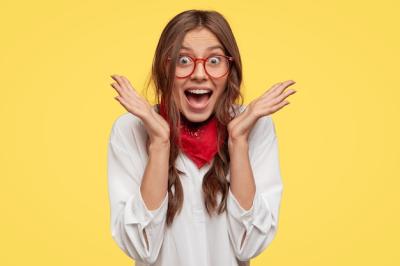 Emotive Woman Reacts Happily in Headshot Stock Photo