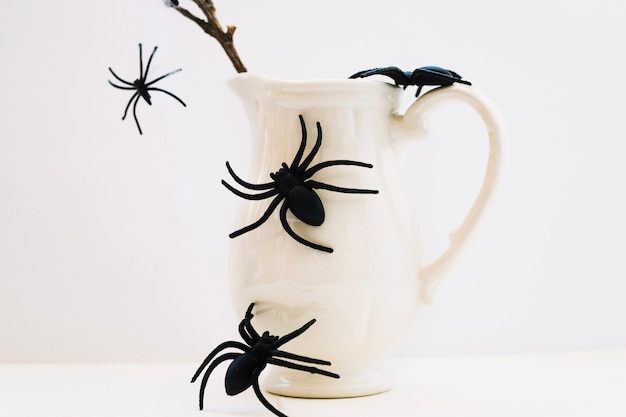 Jug with Fake Spiders – Free Download Stock Photo