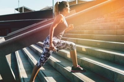 Sporty Woman Stretching in Urban Environment