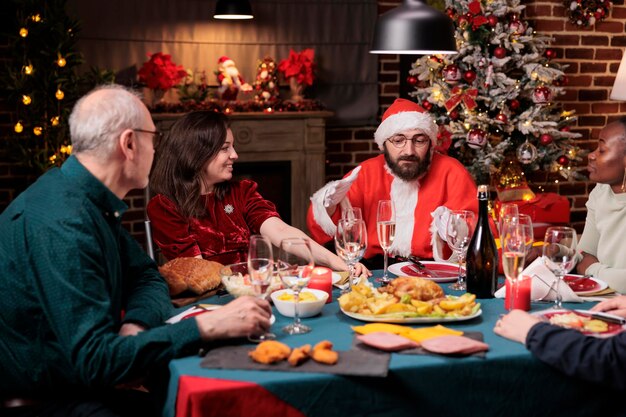 Friends Celebrating Christmas with Traditional Festive Meal