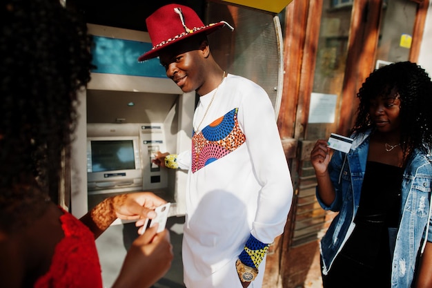 Stylish Trendy Afro France Friends Posed Against ATM