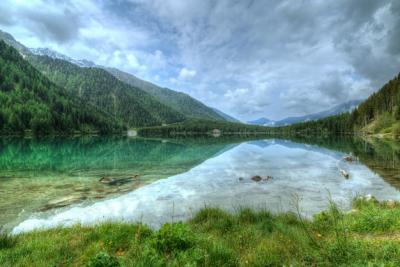 Lake Near Mountain Covered in Trees