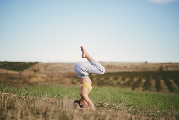 Cute Girl Training on Blue Sky in a Field – Free Stock Photo Download