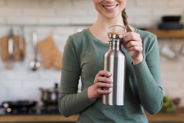 Close-up Smiling Woman Holding Thermos – Free Download