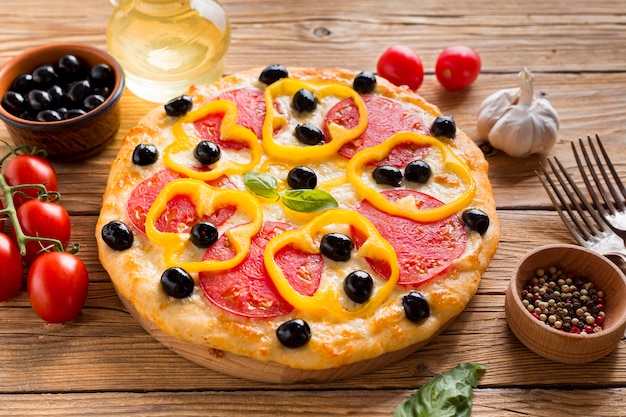 High angle shot of mouthwatering pizza on rustic wooden table