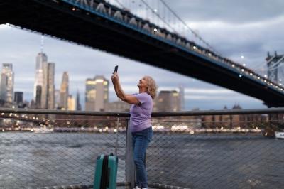 Senior Woman Traveling Around the World