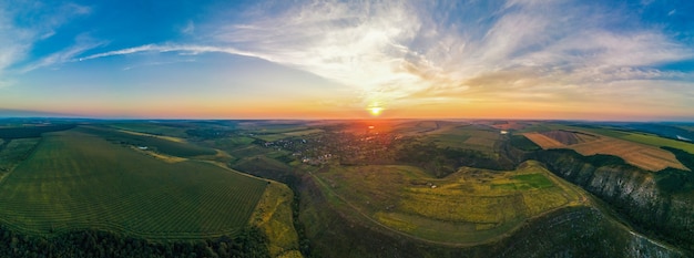 Aerial Drone Panorama View of Nature in Moldova at Sunset. Village, Wide Fields, Valleys