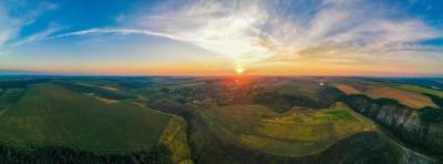 Aerial Drone Panorama View of Nature in Moldova at Sunset. Village, Wide Fields, Valleys