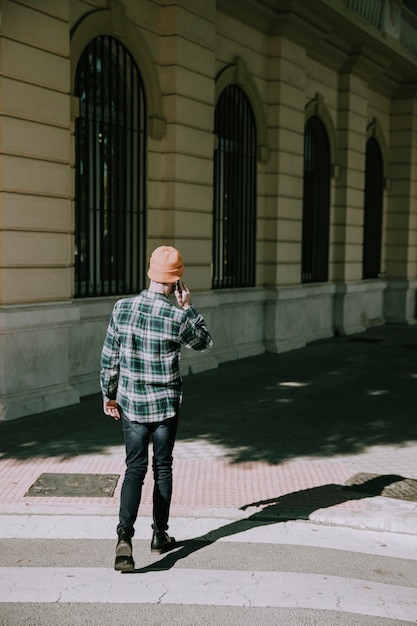 Back view of hipster on zebra crossing – Free Stock Photo Download