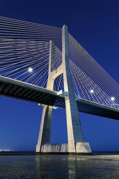 Vertical view of Vasco da Gama bridge by night in Lisbon