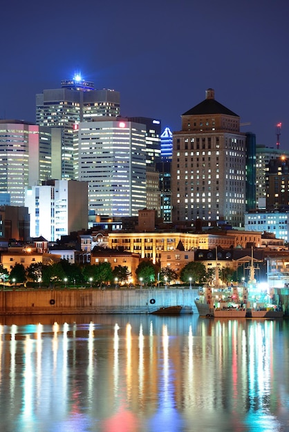 Montreal Over River at Dusk with City Lights and Urban Buildings